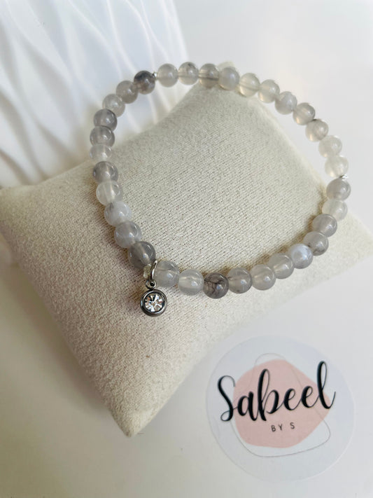 Bracelet Tasbih gris avec breloque ronde scintillante