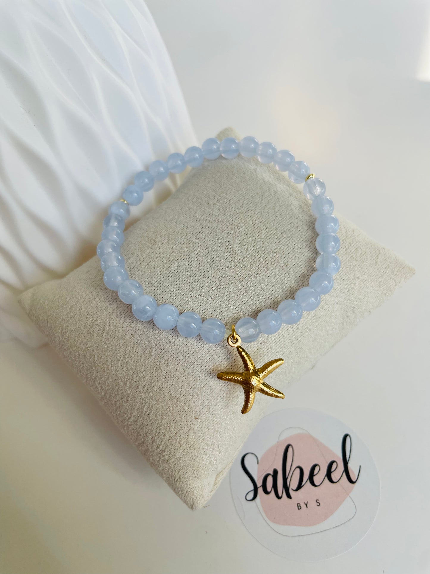 Bracelet Tasbih bleu ciel avec breloque étoile de mer dorée