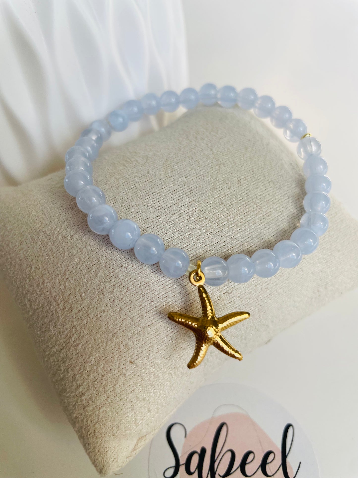 Bracelet Tasbih bleu ciel avec breloque étoile de mer dorée