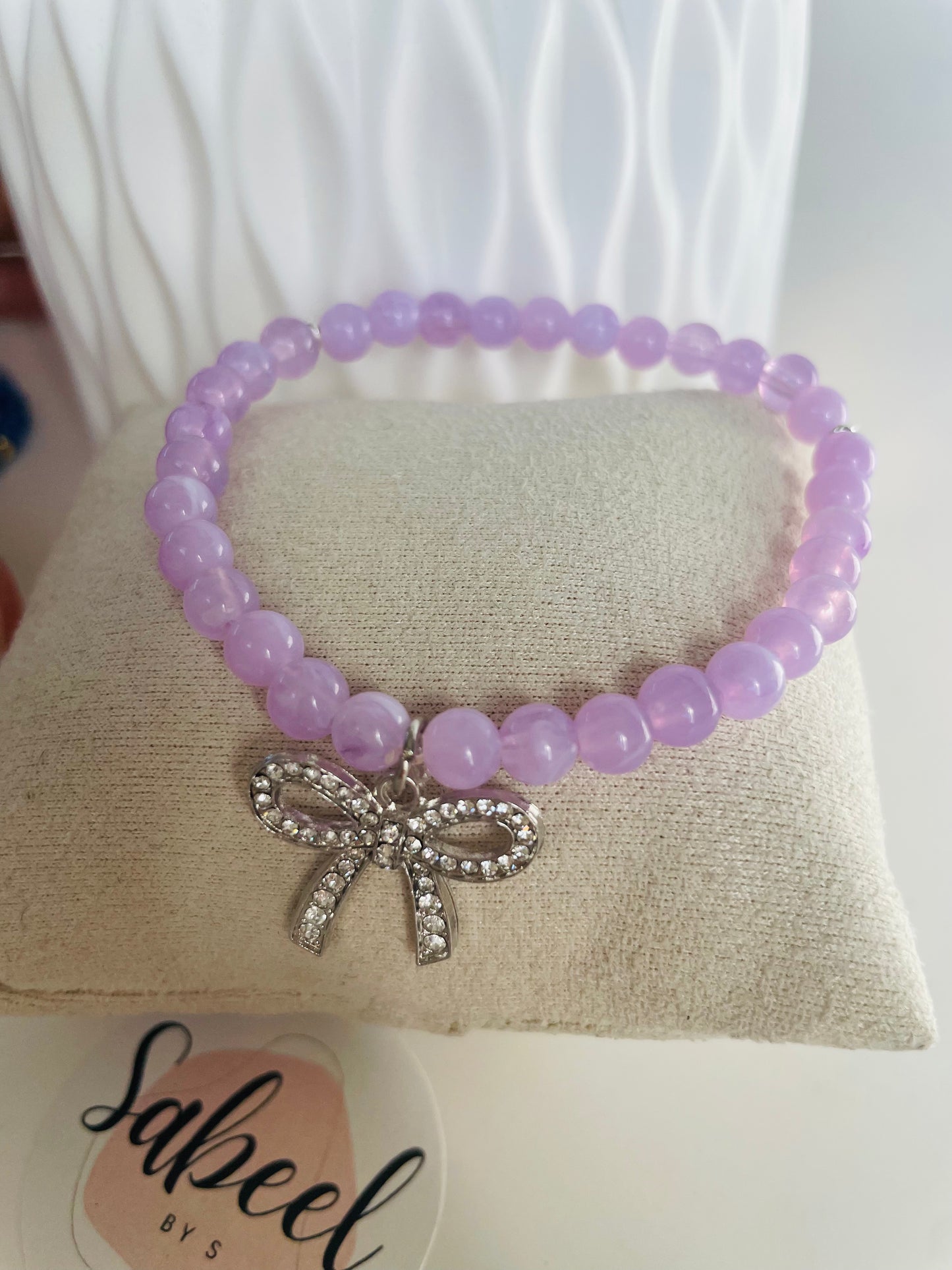 Bracelet Tasbih lilas avec breloque nœud scintillant