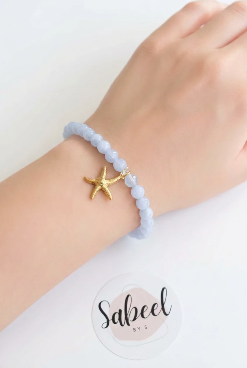 Bracelet Tasbih bleu ciel avec breloque étoile de mer dorée